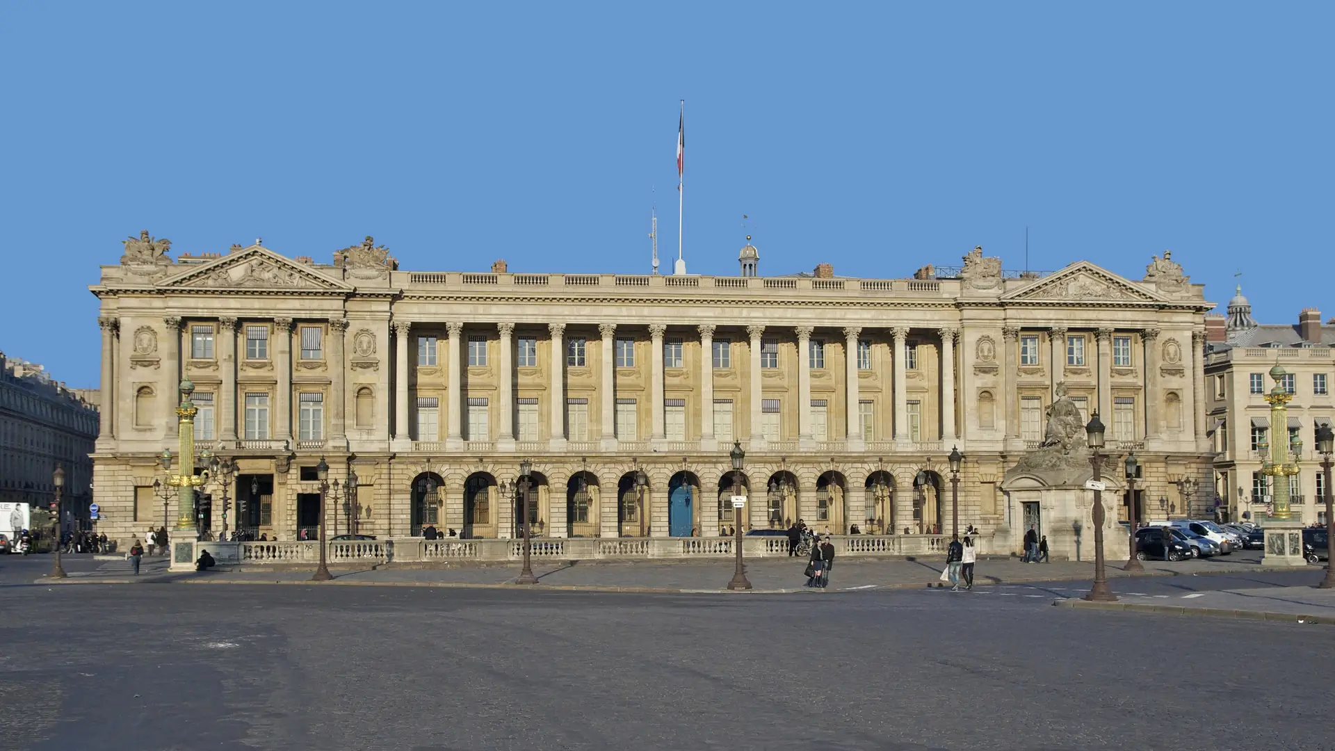 The colonnaded facade of the Hôtel de la Marine seen across the Place de la Concorde in Paris